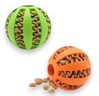 Two rubber kibble dispensing dog toy balls, one green and one orange, both with a spiky interior.