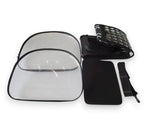 Disassembled black and clear portable pet carrier with transparent plastic panels, a ventilated fabric top, and a strap.