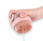 White and orange dog brush with ergonomic handle and soft bristles for pet grooming